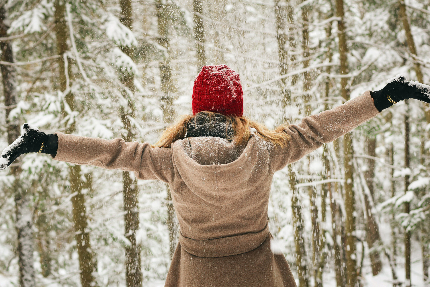 Woman in a forest in winter. How to beat the winter blues.